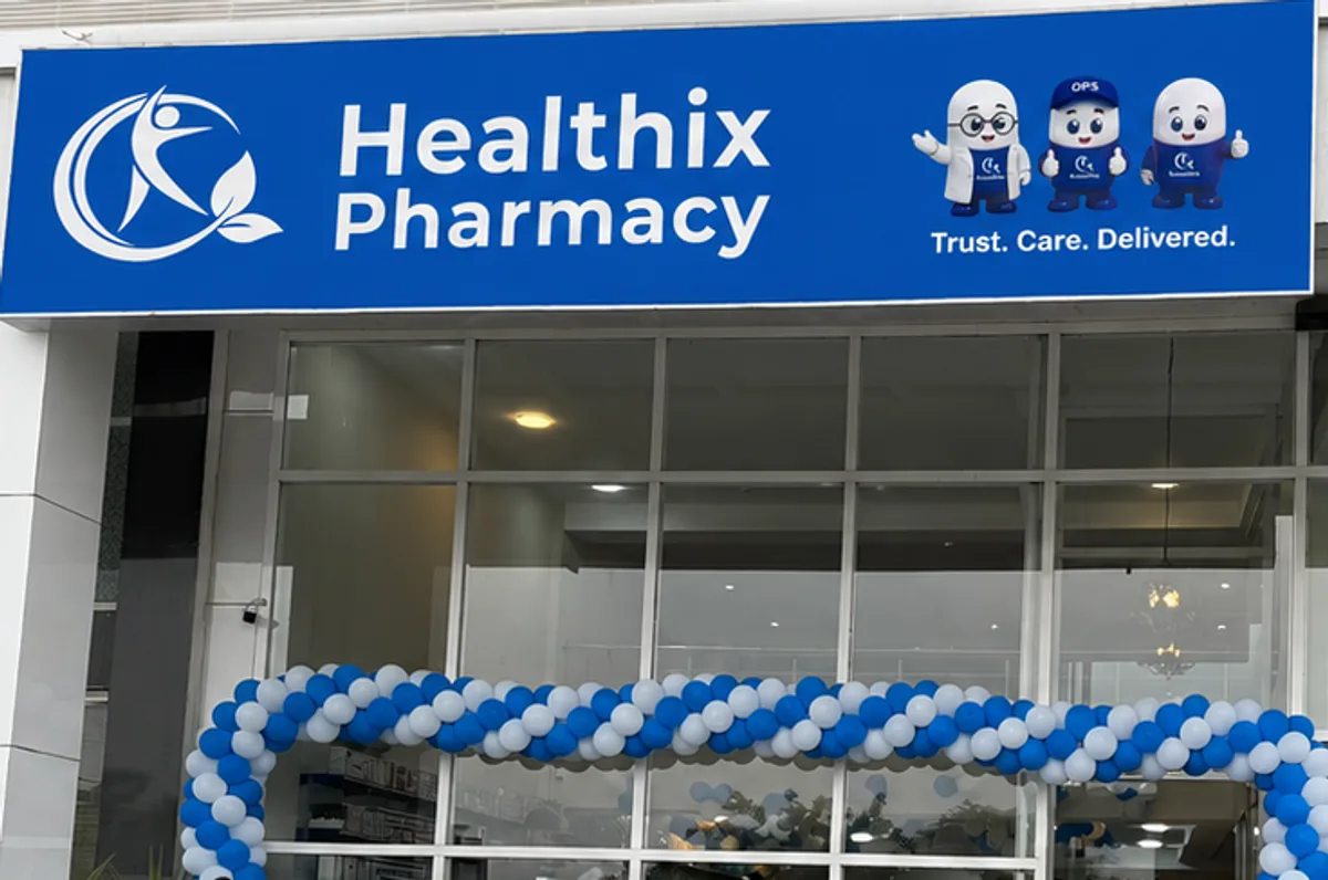 Healthix Pharmacy upcoming branch in Karachi with blue signage and balloon decorations