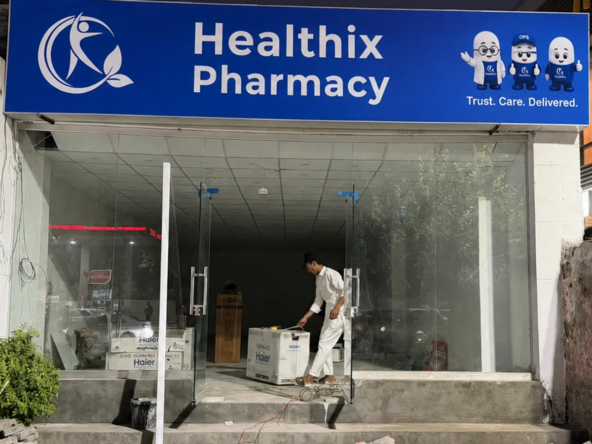 Healthix Pharmacy upcoming branch in Sukkur with blue signage and balloon decorations